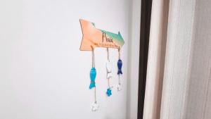 a bunch of earrings hanging on a wall at Ap Anjos de Arraial - Residencial de frente para a Praia dos Anjos - Arraial do Cabo in Arraial do Cabo