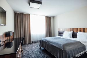 Ein Bett oder Betten in einem Zimmer der Unterkunft Hotel Grauer Bär
