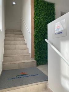 a staircase with a stair mat in front of a stair case at Mirante dos Corais in Porto De Galinhas