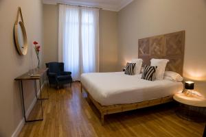 Postel nebo postele na pokoji v ubytování Cami Gallery Barcelona