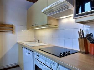 a kitchen with a sink and a counter top at Studio La Plagne, 1 pièce, 4 personnes - FR-1-455-102 in La Plagne