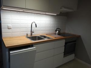 Kuchyňa alebo kuchynka v ubytovaní Dom Mazurska Apartamenty