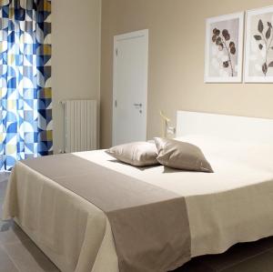 A bed or beds in a room at B&B m’ama non m’ama