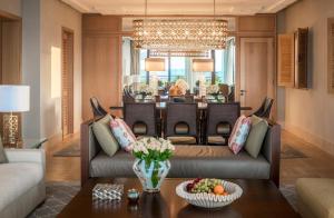 a living room with a couch and a table at Four Seasons Hotel Tunis in Gammarth