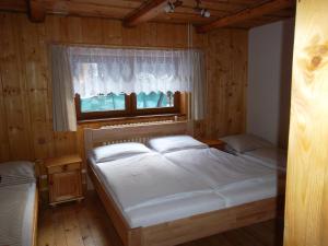 Posteľ alebo postele v izbe v ubytovaní Chata Sipkova I