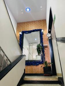 a stairway with a mirror on a brick wall at Gavan Plaza Hotel in Villavicencio