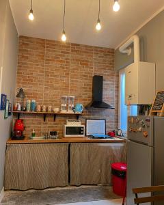 a kitchen with a counter with a laptop on it at Jennys place in Palermo