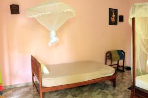 Ένα ή περισσότερα κρεβάτια σε δωμάτιο στο Sigiriya Melrose Villas +31 φωτογραφίες