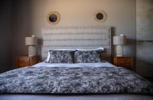 a bedroom with a large bed with two night stands at Palm Beach in Ajaccio