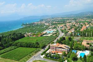 a view of a town with a road and vineyards at Parc Hotel Casa Mia in Lazise