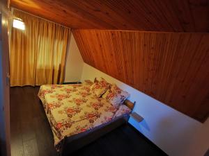 מיטה או מיטות בחדר ב-Vila Eva