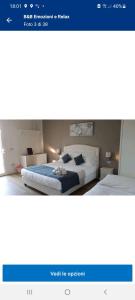 A bed or beds in a room at B&B Emozioni e Relax