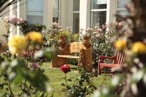 A garden outside SGE Esplanade Hotel