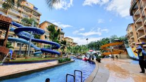 a water park with a slide in the middle at GOLD COAST MORIB by 369 Stay in Kampong Tanjong Pechah