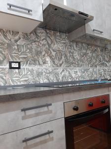 A kitchen or kitchenette at Appartamento ALECATIA 2