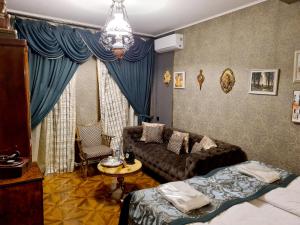 Postel nebo postele na pokoji v ubytování Piano Borracho Boutique Hotel Old Tbilisi