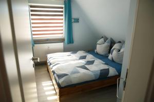 Postel nebo postele na pokoji v ubytování Ferienwohnung Ogger