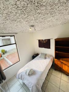 Posteľ alebo postele v izbe v ubytovaní Casa ELA