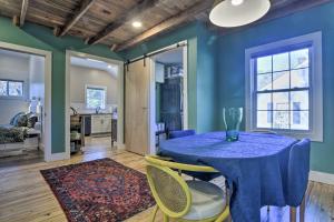 a dining room with a blue table and chairs at Renovated Carrboro House with Deck and Fire Pit! in Carrboro