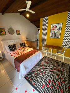 Un pat sau paturi într-o cameră la Vila Noel Centro