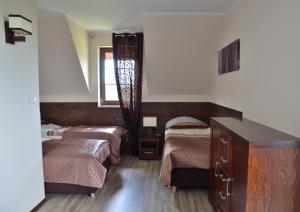 Postel nebo postele na pokoji v ubytování Willa Dąbrowa + 106 fotografií