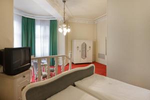 TV a/nebo společenská místnost v ubytování acom-Hotel Berlin Kurfürstendamm