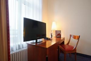 TV a/nebo společenská místnost v ubytování acom-Hotel Berlin Kurfürstendamm