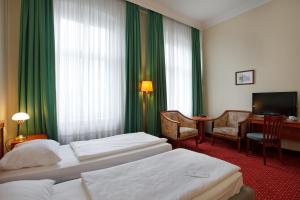 Postel nebo postele na pokoji v ubytování acom-Hotel Berlin Kurfürstendamm