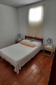 Postel nebo postele na pokoji v ubytování Hostel Universo