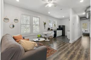 a living room with a couch and a table at Impressive Cozy Historic 2BR Apt Near Downtown in San Antonio