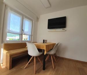 Televízia a/alebo spoločenská miestnosť v ubytovaní Domus Helios