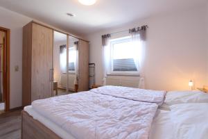 Ένα ή περισσότερα κρεβάτια σε δωμάτιο στο Kaiserhof Whg 5