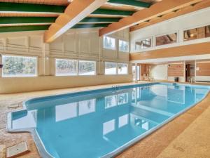 a large swimming pool in a large house at Cozy Wildernest Loft at the top of Buffalo Mountain condo in Silverthorne