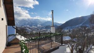 a balcony of a house with a view of mountains at Bran Hill in Bran