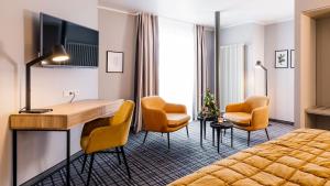 TV a/nebo společenská místnost v ubytování Hotel Ambiente