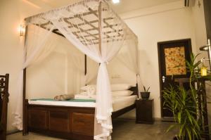 Katil atau katil-katil dalam bilik di Gem Light Guest House