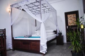 Katil atau katil-katil dalam bilik di Gem Light Guest House