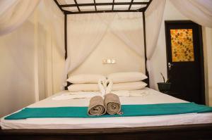 Katil atau katil-katil dalam bilik di Gem Light Guest House