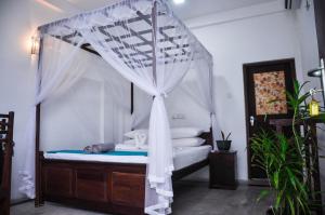 Katil atau katil-katil dalam bilik di Gem Light Guest House