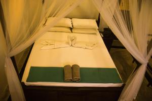 Katil atau katil-katil dalam bilik di Gem Light Guest House