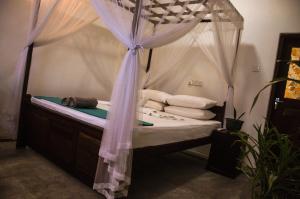 Katil atau katil-katil dalam bilik di Gem Light Guest House