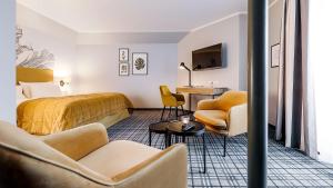 TV a/nebo společenská místnost v ubytování Hotel Ambiente