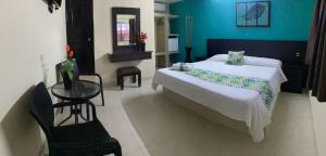 Katil atau katil-katil dalam bilik di Hotel San Miguel