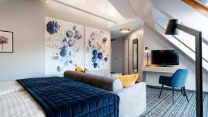TV a/nebo společenská místnost v ubytování Hotel Ambiente