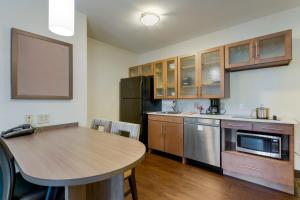 A kitchen or kitchenette at Candlewood Suites Reading, an IHG Hotel