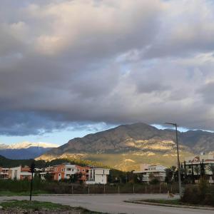 a view of a city with mountains in the background at Elijah Hotel in Kemer