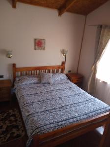 En eller flere senge i et værelse på Cabañas el Estero