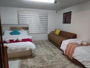 מיטה או מיטות בחדר ב-Cosy Appartement