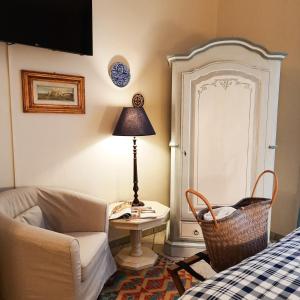 a living room with a couch and a table at Boutique Hotel Fox's Inn in San Giustino Valdarno