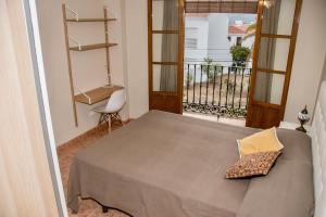 Łóżko lub łóżka w pokoju w obiekcie Casa con increíbles vistas a las montañas y al mar